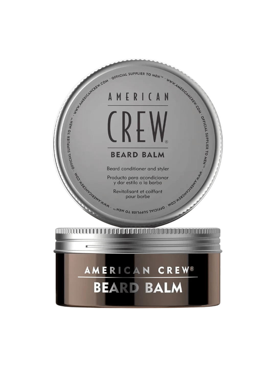 Round bronze-brown tin labeled American Crew Beard Balm with its silver screw lid removed and displayed above it, on a light grey backdrop.