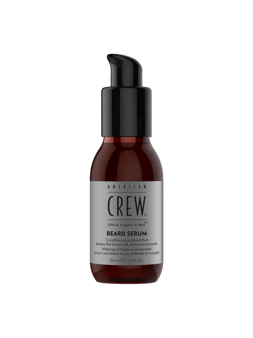 Amber dropper-pump bottle with a black pump top, labeled American Crew Beard Serum 50mL, on a light grey backdrop.