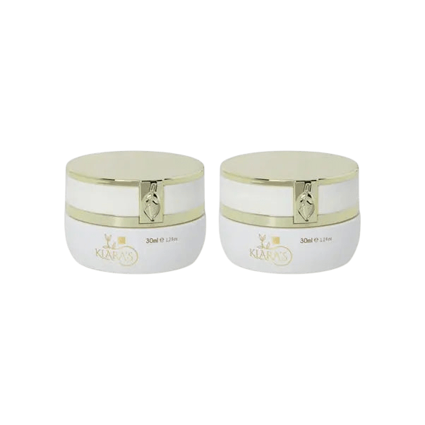 Two identical white cylindrical jars with glossy gold lids and gold trim, each labeled Klara's, 30ml, standing side by side on a plain light gray background.